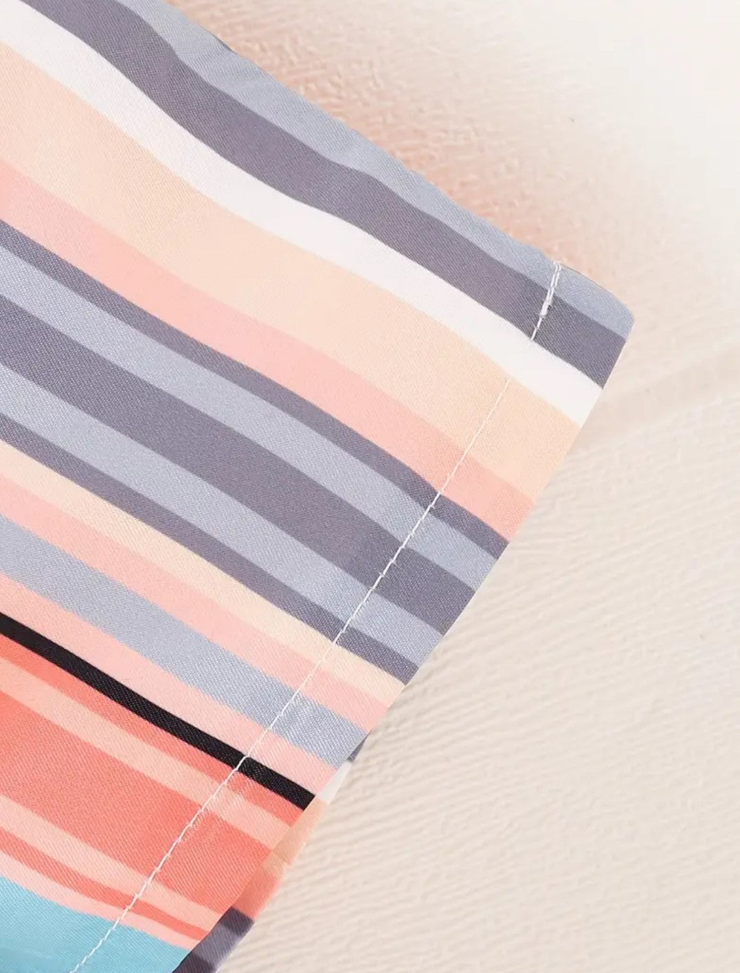 Casual sleeveless top with striped shorts